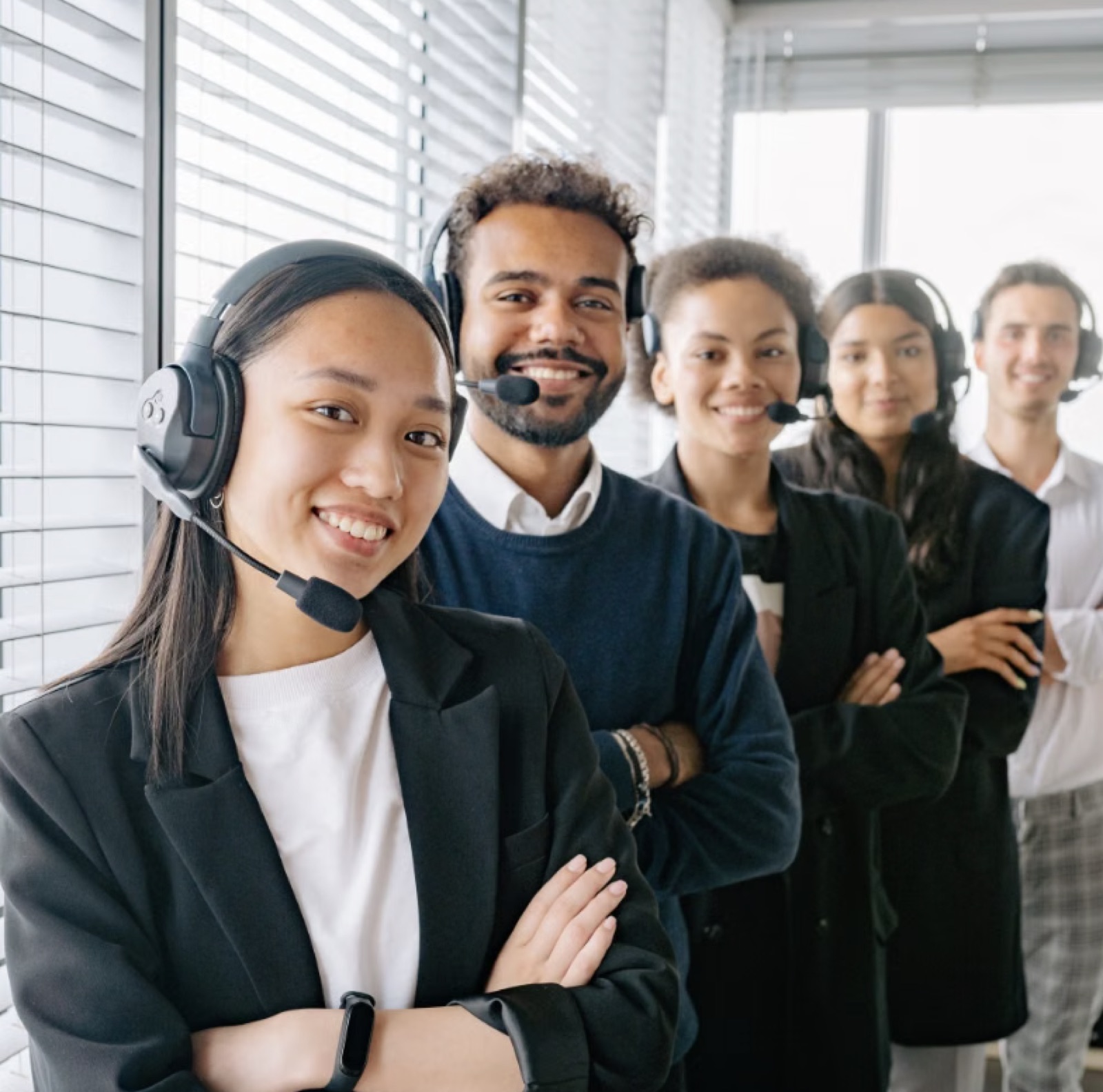 Diverse client support team with headsets ready to assist