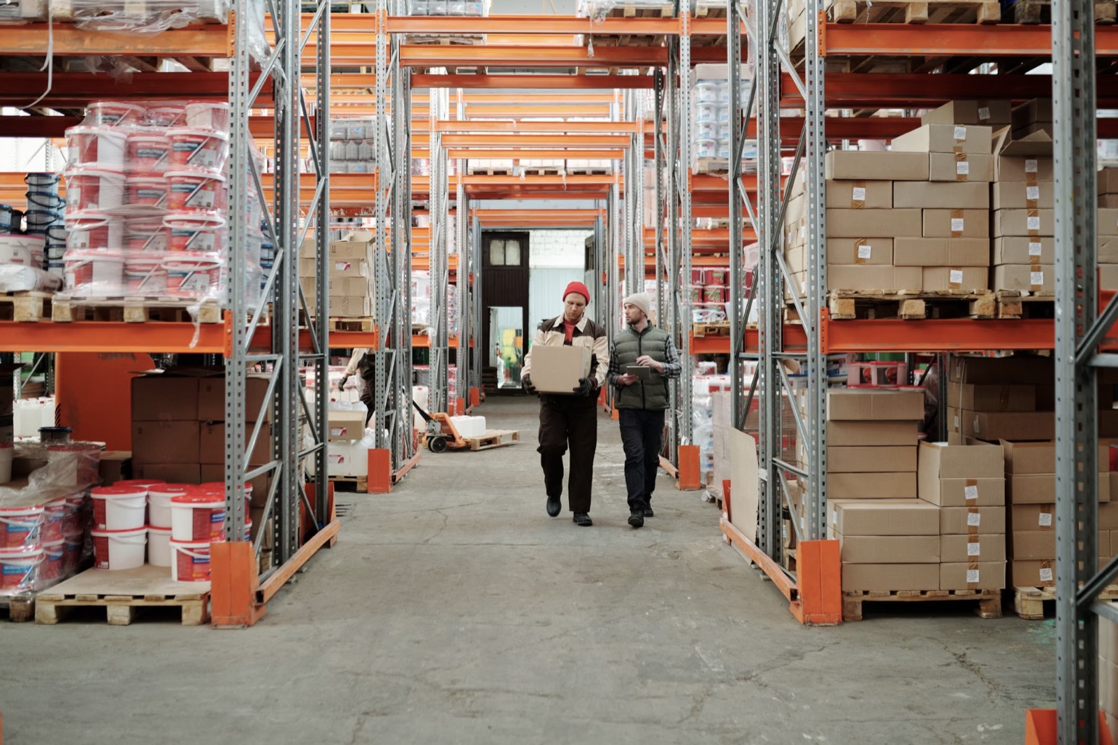Warehouse team managing inventory on an industrial aisle
